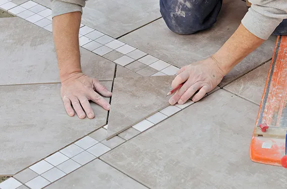 Artistic tile layout being installed, showcasing custom design options in Liberty, MO.