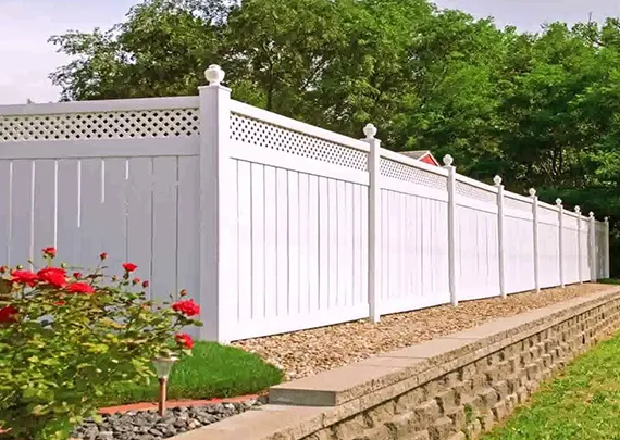 White vinyl fence installation in a Lee's Summit, MO backyard.