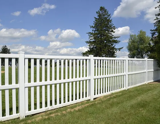 White picket wood fence installation in Blue Springs, MO.